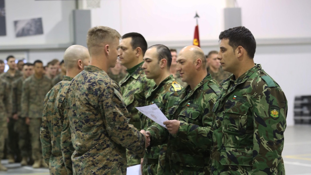 Soldiers from the nations of Bulgaria, Serbia and Romania receive certificates after the completion of Platinum Lion 15 at Novo Selo Training Area, Bulgaria, Jan 26. Platinum Lion was a multi-national exercise with the nations of Bulgaria, Serbia and Romania and Black Sea Rotational Force Marines. 