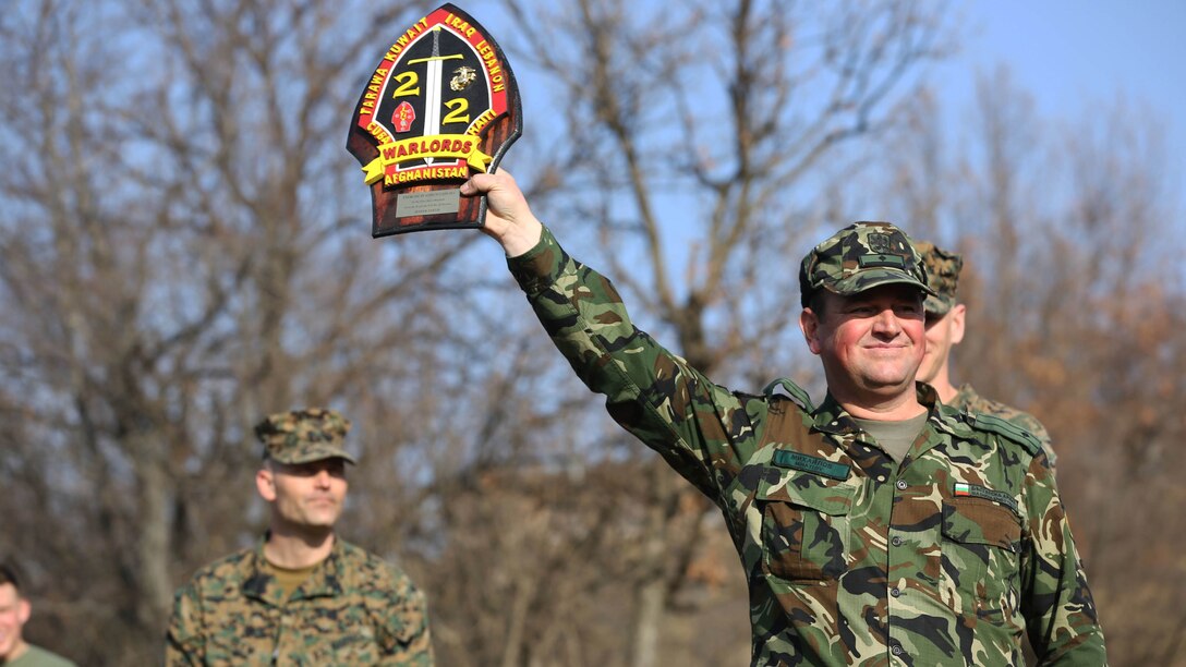 A Bulgarian soldier holds up the plaque his unit was awarded after Platinum Lion 15 at Novo Selo Training Area, Bulgaria, Jan 26. Platinum Lion was a multi-national exercise with the nations of Bulgaria, Serbia and Romania and Black Sea Rotational Force Marines. 