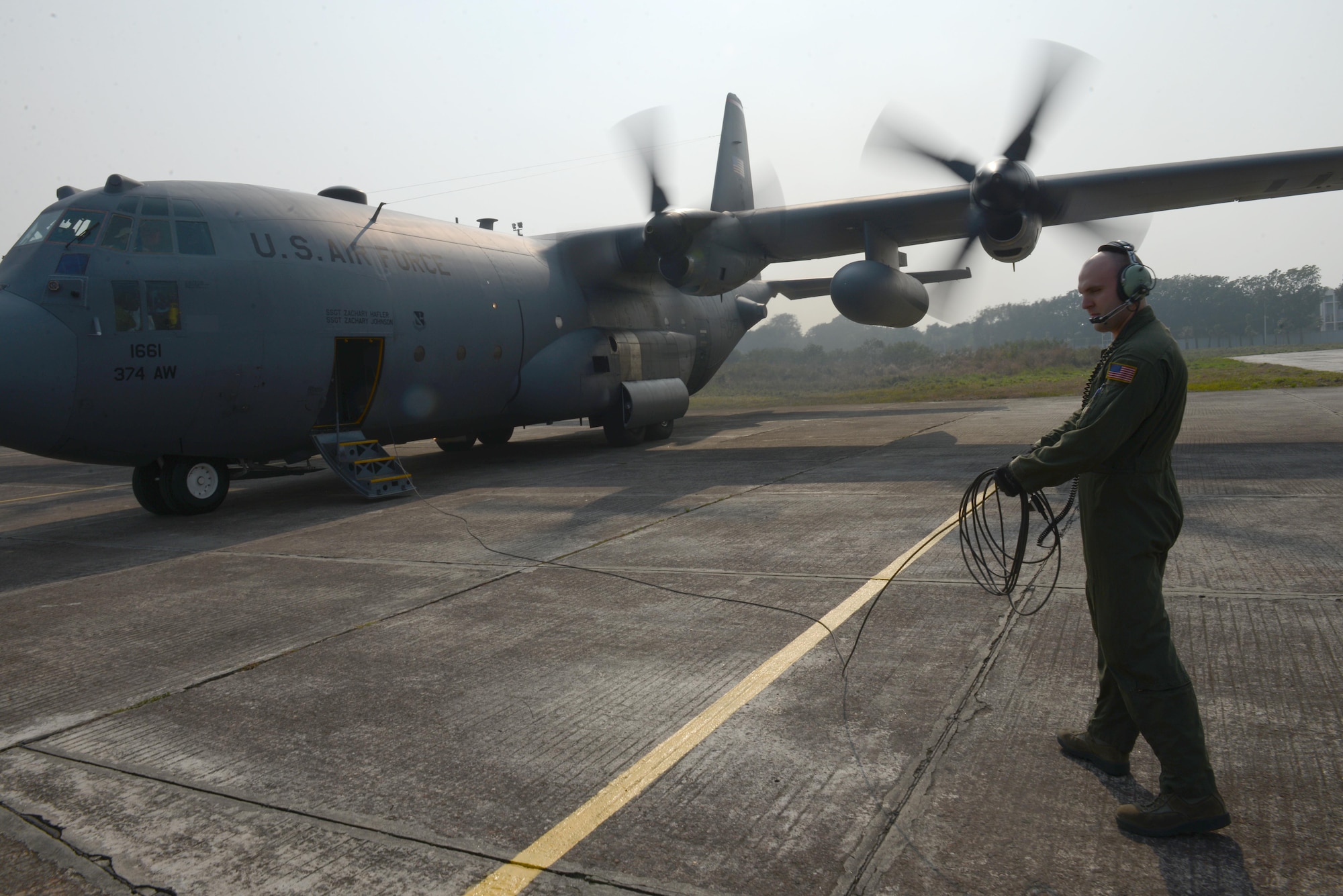 Staff Sgt. Noel Jones prepares to board a C-130H aircraft after engines start Jan. 24, 2015 during exercise Cope South at Bangladesh air force base, Bangabandhu, Bangladesh. Cope South helps cultivate common bonds, foster goodwill, and improve readiness and compatibility between members of the Bangladesh and U.S. Air Forces. Jones is a loadmaster assigned to the 36th Airlift Squadron, Yokota Air Base, Japan.  (U.S. Air Force photo/1st Lt. Jake Bailey)