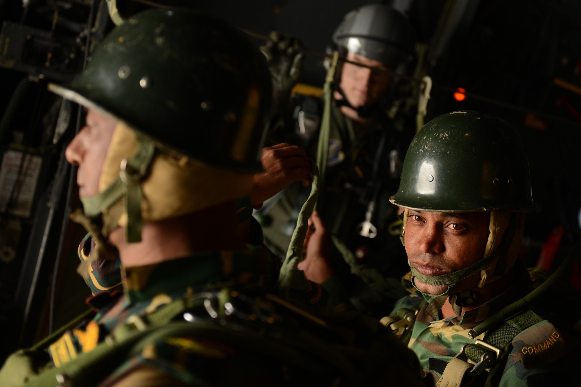 Bangladeshi commandos prepare to jump from a U.S. Air Force C-130H aircraft Jan. 24, 2015 during exercise Cope South near Sylhet, Bangladesh. The exercise helps cultivate common bonds, foster goodwill, and improve readiness and compatibility between members of the Bangladesh and U.S. Air Forces. (U.S. Air Force photo/1st Lt. Jake Bailey)