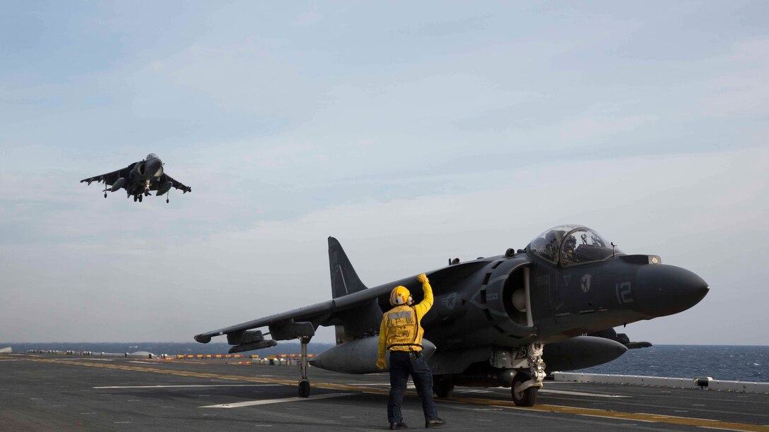 An AV-8B Harrier lands on the flight deck of the amphibious assault ship USS Kearsarge (LHD 3). Kearsarge is underway conducting Afloat Training Group basic phase training.