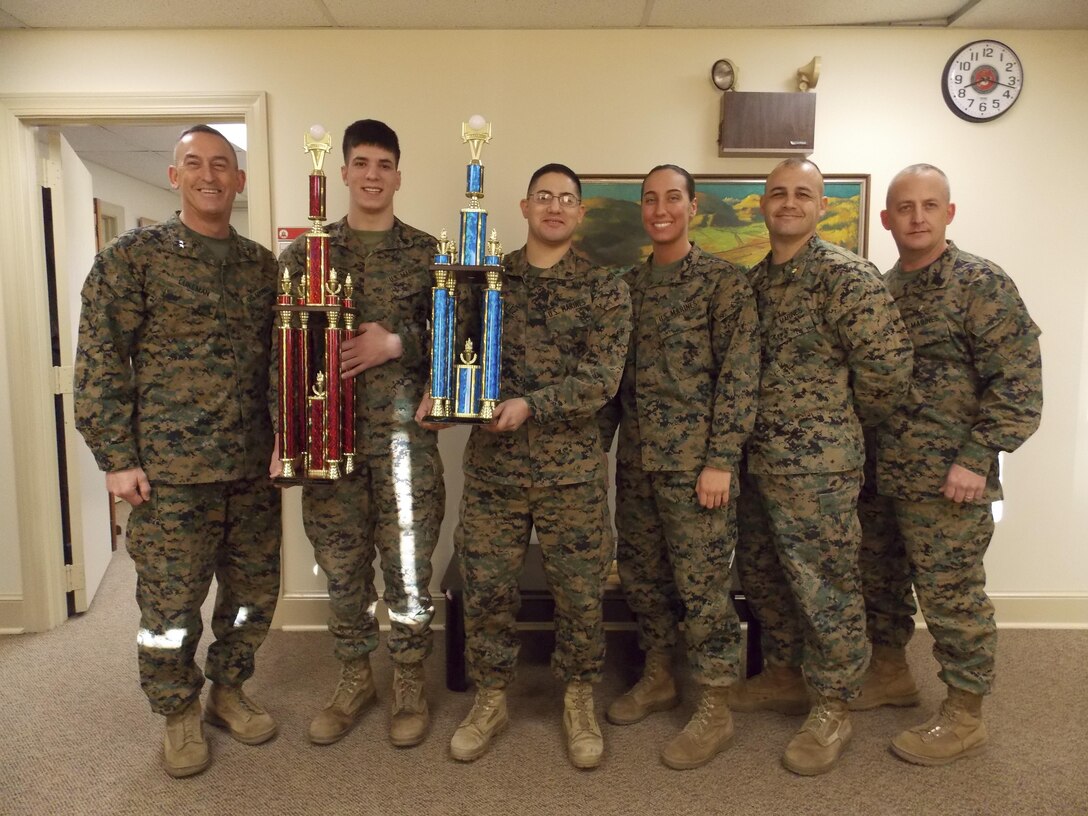 Training and Education Command Commanding General, Maj. Gen. James W. Lukeman and Sergeant Major, Sgt. Maj. Justin D. LeHew, stand with members of the 2014 TECOM intramural volleyball championship team. Pictured from left to right are Sgt. Joseph Battaglia, Cpl. Francisco Gonzalez, Cpl. Ashely Latterner, and Team Captain Maj. Brian Trievel.
Not pictured: Capt. Luke Balthazar, Sgt. Justin Borszem, Sgt. Jose Ramirez, Sgt. Jonathan Harris, Cpl. Sean Youdis, Cpl. James Willis, Cpl. Adam Hindes, Lance Cpl. Shane Bristolaldrich, Pfc. Omri Blair, and Mr. Moses Saucedo.
