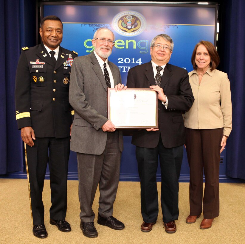William Goran, formerly of ERDC-CERL, receives the 2014 GreenGov Climate Champion Award.  Pictured are Lt. Gen. Thomas P. Bostick, USACE chief of engineers and commanding general, Goran, Sam Higuchi of NASA and Assistant Secretary of the Army (Civil Works) Jo-Ellen Darcy. 