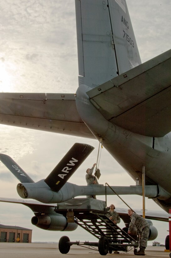 Staff Sgt. Edward Porter, 362nd Training Squadron instructor, teaches Airman Connor Harbuck and Airman 1st Class Jake Bumbaca, 362nd Training Squadron students, how to install and remove a boom sling. A boom sling is used to ensure the air refueling boom does not fall due to hydraulic or electrical power failures. (U.S. Air Force photo by Danny Webb/Released)
