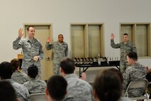 Capt. Kennard Keeton (left), Air Force Special Victims’ Counsel to the Joint Base Lewis-McChord region, speaks with Airmen at the 627th Communications Squadron, Jan. 23, 2014, at JBLM, Wash. Since becoming an SVC in the JBLM region, Keeton has represented more than thirty individuals. (U.S. Air Force photo/Senior Airman Rebecca Blossom)