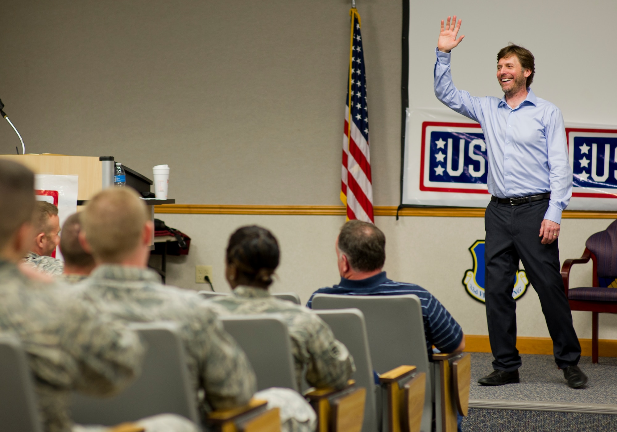 Erik Stolhanske, actor/writer from the movies “Super Troopers”, “The Slammin’ Salmon” and “Beerfest” and member of the comedy group Broken Lizard, speaks to Tyndall Airmen during a Game On Nation seminar Jan. 23 in the 337th Air Control Squadron auditorium. Game On Nation is a company dedicated to training groups in communication, leadership, teambuilding and media training through fun and interactive games that break down barriers and create a positive, comfortable environment.  (U.S. Air Force photo by Senior Airman Alex Echols/Released)