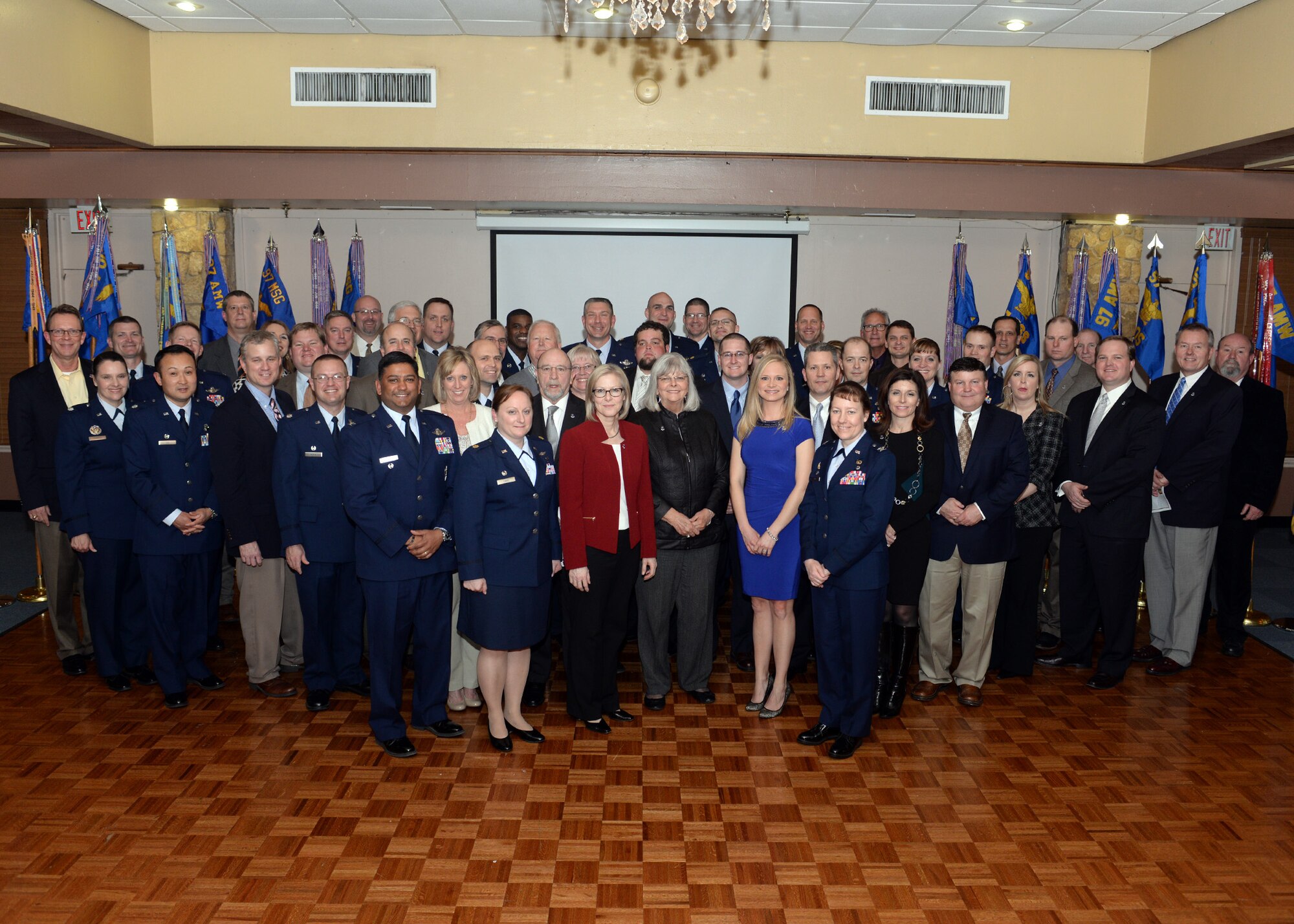 ALTUS AIR FORCE BASE, Okla. – Members of Altus AFB and the City of Altus pose for a photo during an Honorary Commander Induction Ceremony at Club Altus, Jan. 26, 2015. The purpose of the Honorary Commander program is to foster a link between Altus AFB senior leadership and civilian supporters. (U.S. Air Force photo by Senior Airman Franklin R. Ramos/Released)