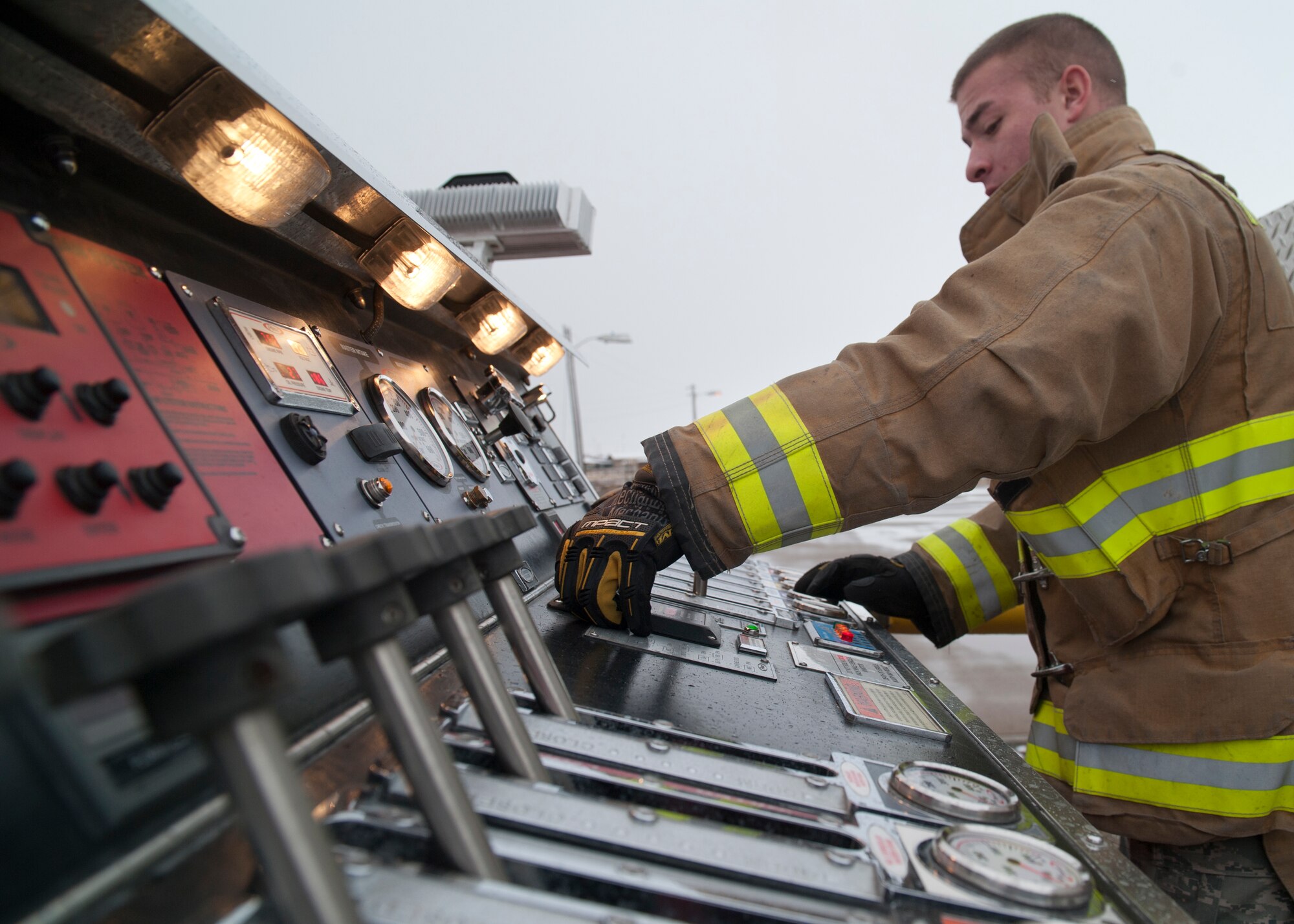 A member of the 49th Civil Engineering Squadron Fire Protection Flight controls the water hoes during a POL fuel leak training exercise at Holloman Air Force Base, N.M., Jan. 22. Firefighters from the 49th CES performed a series of procedures to secure the area and maintain the simulated fire. (U.S. Air Force photo by Senior Airman Colin Cates/Released)