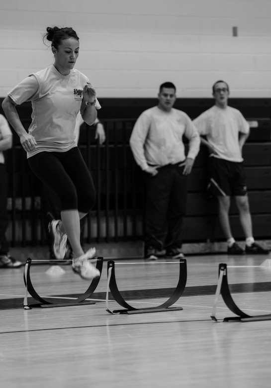 U.S. Air Force Staff Sgt. Cristina Sullivan, 633rd Force Support Squadron Back 2 Basics lead instructor, demonstrates an exercise during a B2B class at Langley Air Force Base, Va., Jan. 8, 2015. B2B is an eight-week fitness program designed to be a lifestyle change, not a temporary diet or fitness regimen. (U.S. Air Force photo by Senior Airman Kayla Newman/Released) 