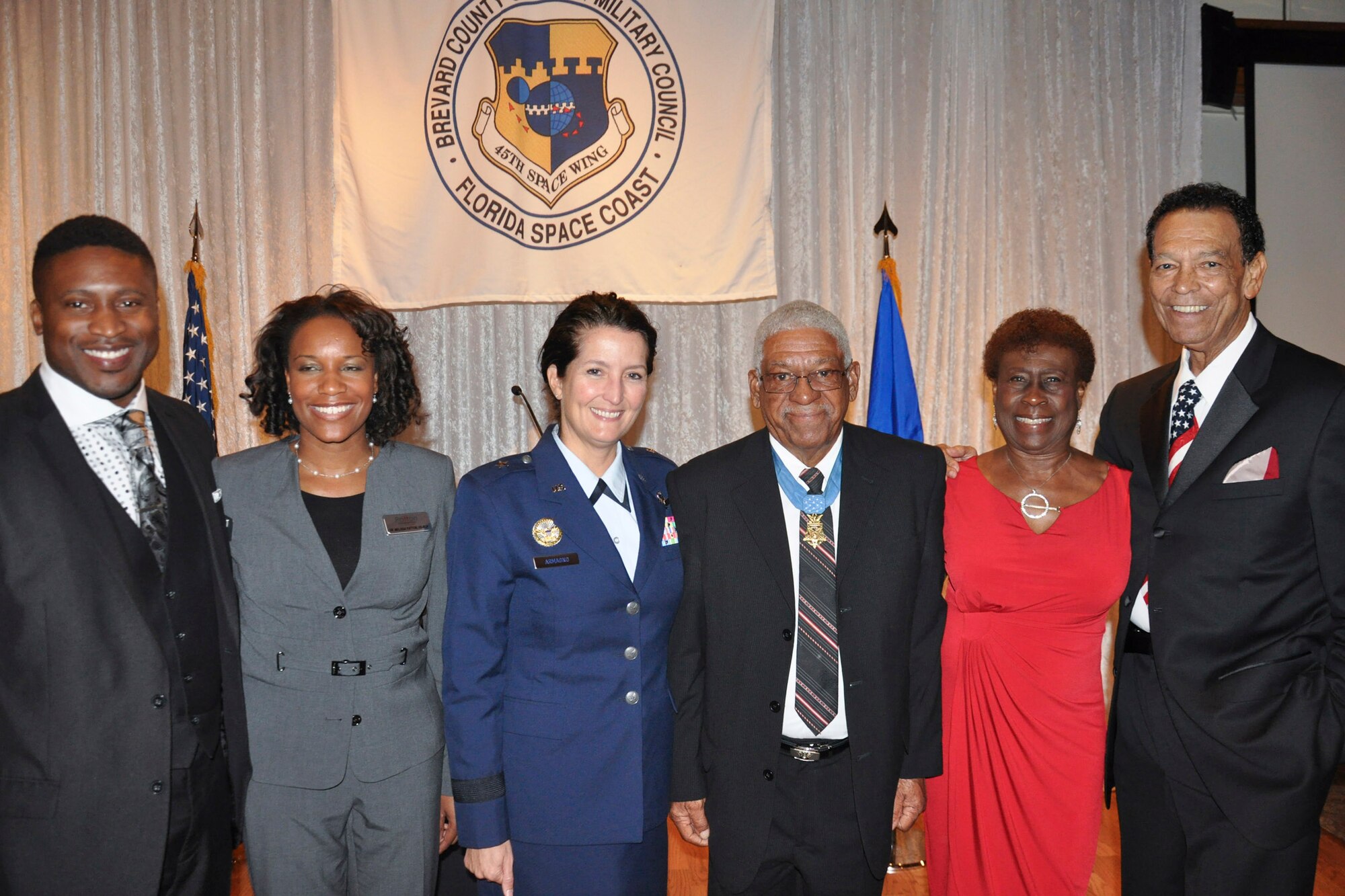 Stanley Patton, Melissa Patton, Brig. Gen. Nina Armagno, 45th Space Wing

commander, Sgt. 1st Class Melvin Morris, Medal of Honor recipient, and his

wife, Mary Morris, and Richard Blake pose for a photo during the annual

Commander's Civilian Military Community Relations Council Banquet, Jan. 24

at the Tides. Sergeant 1st Class Morris was the guest of honor at the event. (U.S. Air Force photo/Tech. Sgt. Erin Smith)

