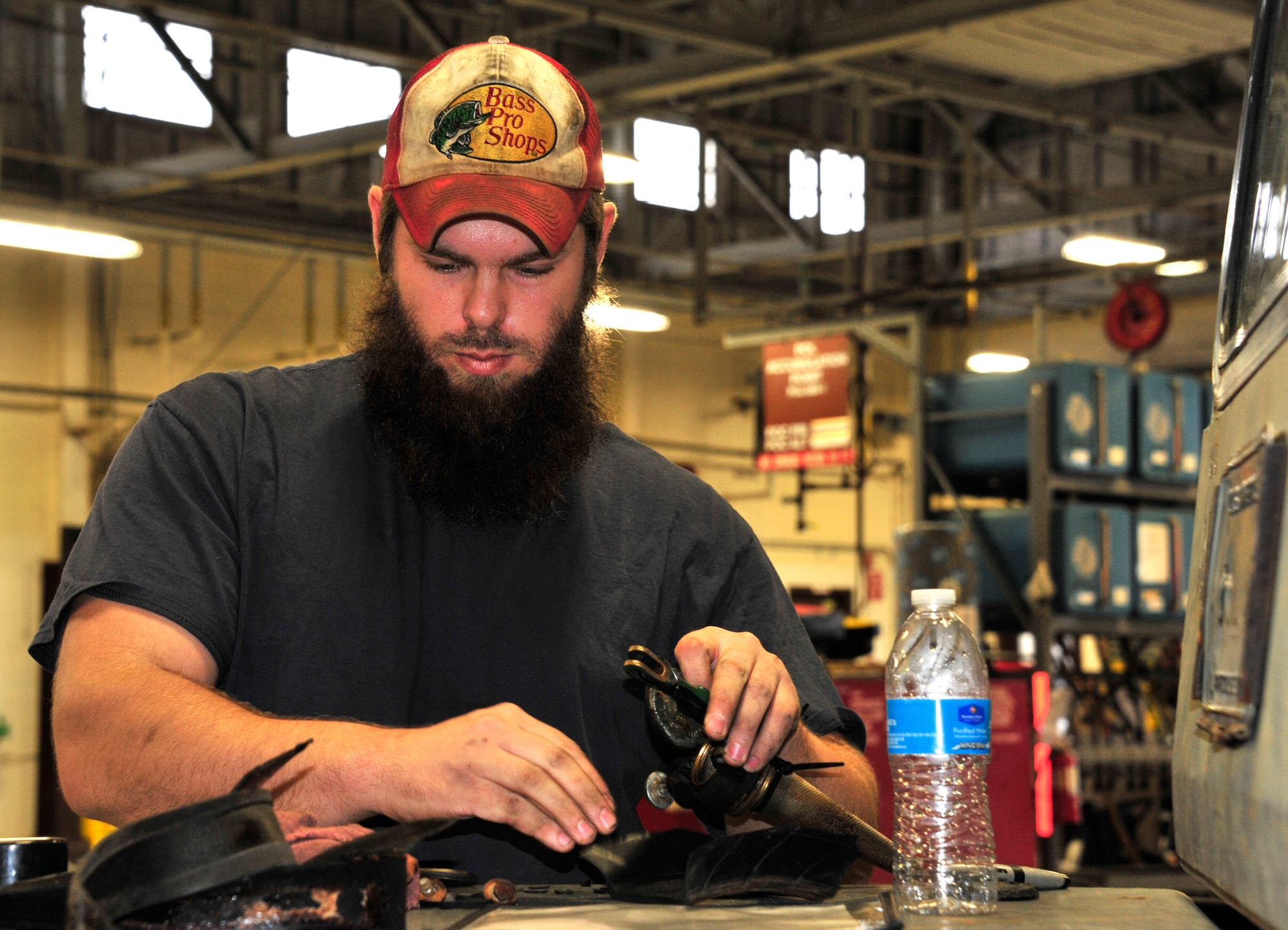 Daniel Steppe, a 96th Logistics Readiness Squadron automotive mechanic, replaces clogged fuel lines on an MB-4 aircraft tow tractor at a vehicle maintenance facility on Eglin Air Force Base, Fla., Jan. 14.  The 96th Vehicle Management Flight provides all of Eglin's vehicle support and maintenance requirements and is the largest in the United States and the third largest in the U.S. Air Force