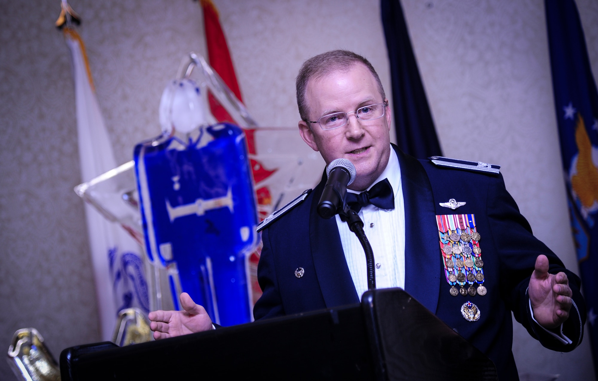 Col. Jeffrey DeVore, Joint Base Charleston commander, speaks to an audience of Airmen and Sailors Jan. 23, 2015, at the 2015 628th Air Base Wing Annual Awards Banquet at the Charleston Club on Joint Base Charleston, S.C. (U.S. Air Force photo/Airman 1st Class Clayton Cupit)