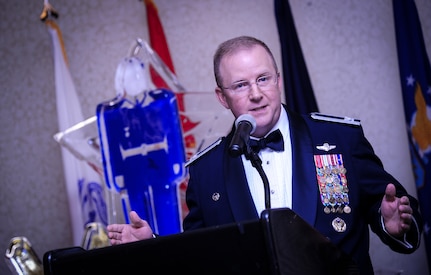 Col. Jeffrey DeVore, Joint Base Charleston commander, speaks to an audience of Airmen and Sailors Jan. 23, 2015, at the 2015 628th Air Base Wing Annual Awards Banquet at the Charleston Club on Joint Base Charleston, S.C. (U.S. Air Force photo/Airman 1st Class Clayton Cupit)