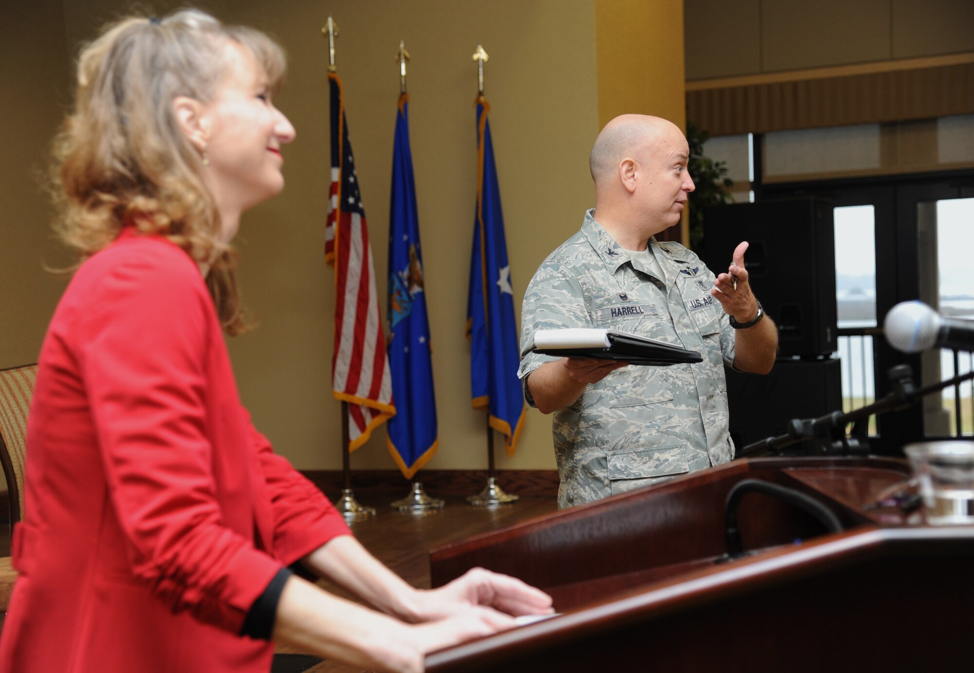 Col. Thomas Harrell, 81st Medical Group commander, introduces his wife to speak to attendees during a 81st MDG flight chief course Jan. 15, 2015, at the Bay Breeze Event Center, Keesler Air Force Base, Miss.  Approximately 90 military members and 10 spouses attended the two day leadership event.  (U.S. Air Force photo by Kemberly Groue)