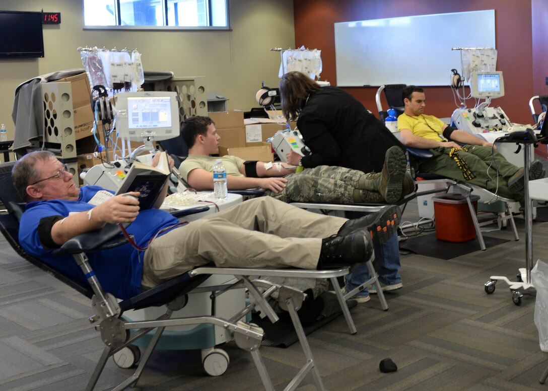 Airmen and base personnel volunteer to donate blood during a blood drive inside the deployment center at Ellsworth Air Force Base, S.D., Jan. 23, 2015. More than 25 million people in communities throughout the United States depend on United Blood Services’ volunteer blood donors and staff to ensure blood is available nation - wide. (U.S. Air Force photo by Senior Airman Anania Tekurio/Released)