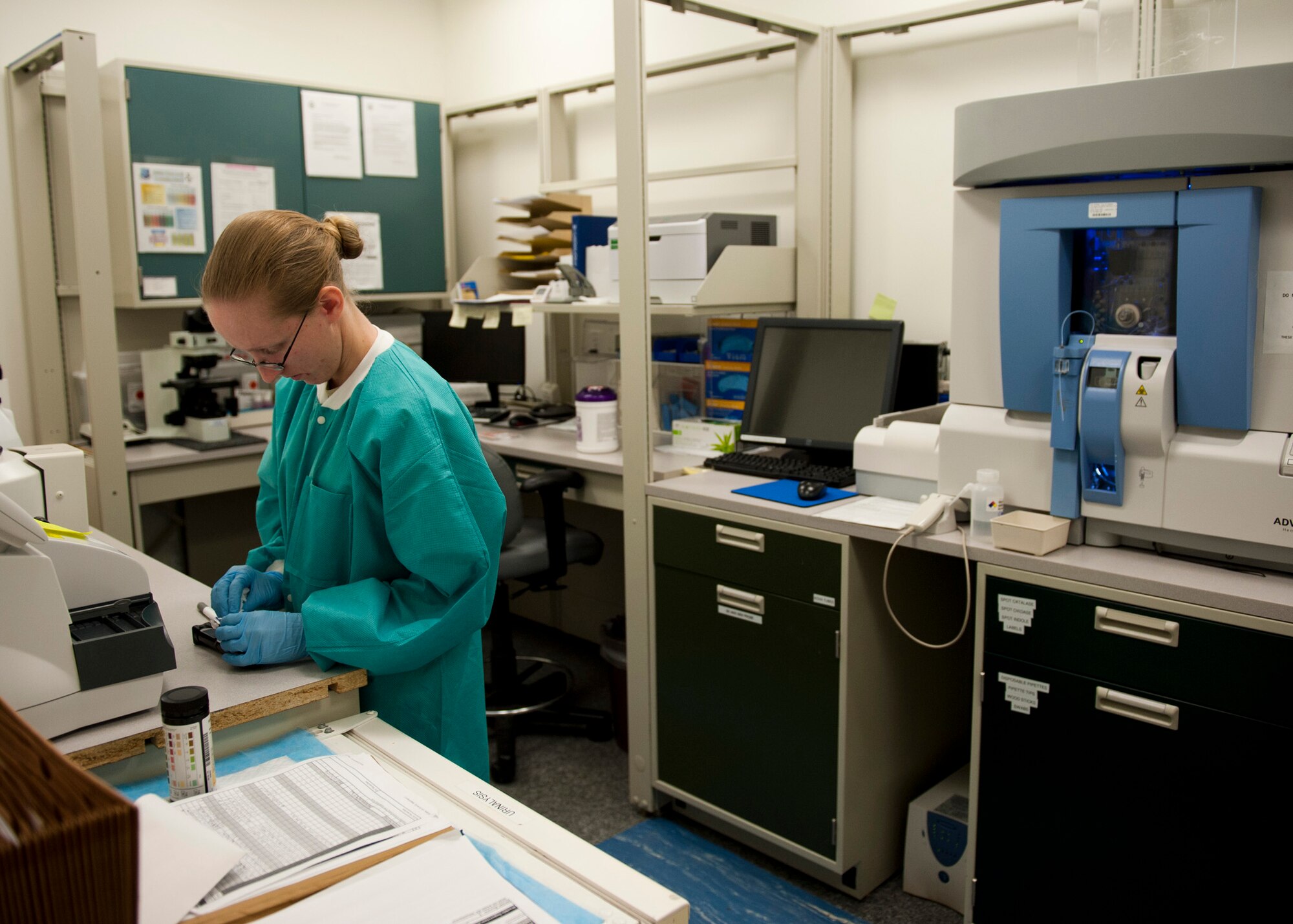 PETERSON AIR FORCE BASE, Colo. – Staff Sgt. Shannon Ford, 21st Medical Support Squadron medical laboratory technician, prepares to run tests on fluids in the medical laboratory Jan. 21, 2015. The laboratory is part of the 21st Medical Group and comprised of more than 500 medical professionals who provide healthcare and mission-readiness support for more than 25,000 active duty, retired and family members. (U.S. Air Force photo by Senior Airman Tiffany DeNault)