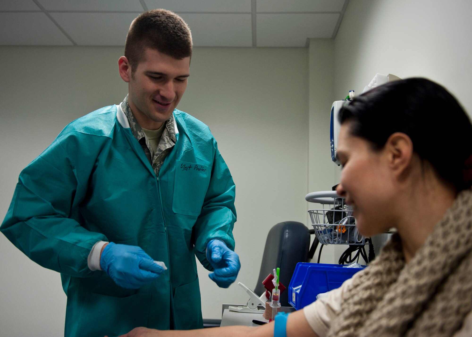PETERSON AIR FORCE BASE, Colo. – Staff Sgt. Clayton Proffer, 21st Medical Support Squadron medical laboratory technician, draws blood at the main clinic Jan. 21, 2015. The laboratory is part of the 21st Medical Group and comprised of more than 500 medical professionals who provide healthcare and mission-readiness support for more than 25,000 active duty, retired and family members. (U.S. Air Force photo by Senior Airman Tiffany DeNault)