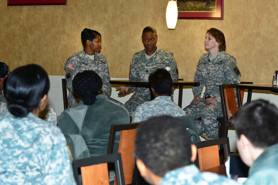 A panel of three U.S. Army senior noncommissioned officers sit on a panel during a Sisters-in-Arms forum at Fort Eustis, Va., Jan. 23, 2015. The panel spoke to the all-female crowd on the topic of ‘how to improve work performance.’ (U.S. Air Force photo by Senior Airman Kimberly Nagle/Released)