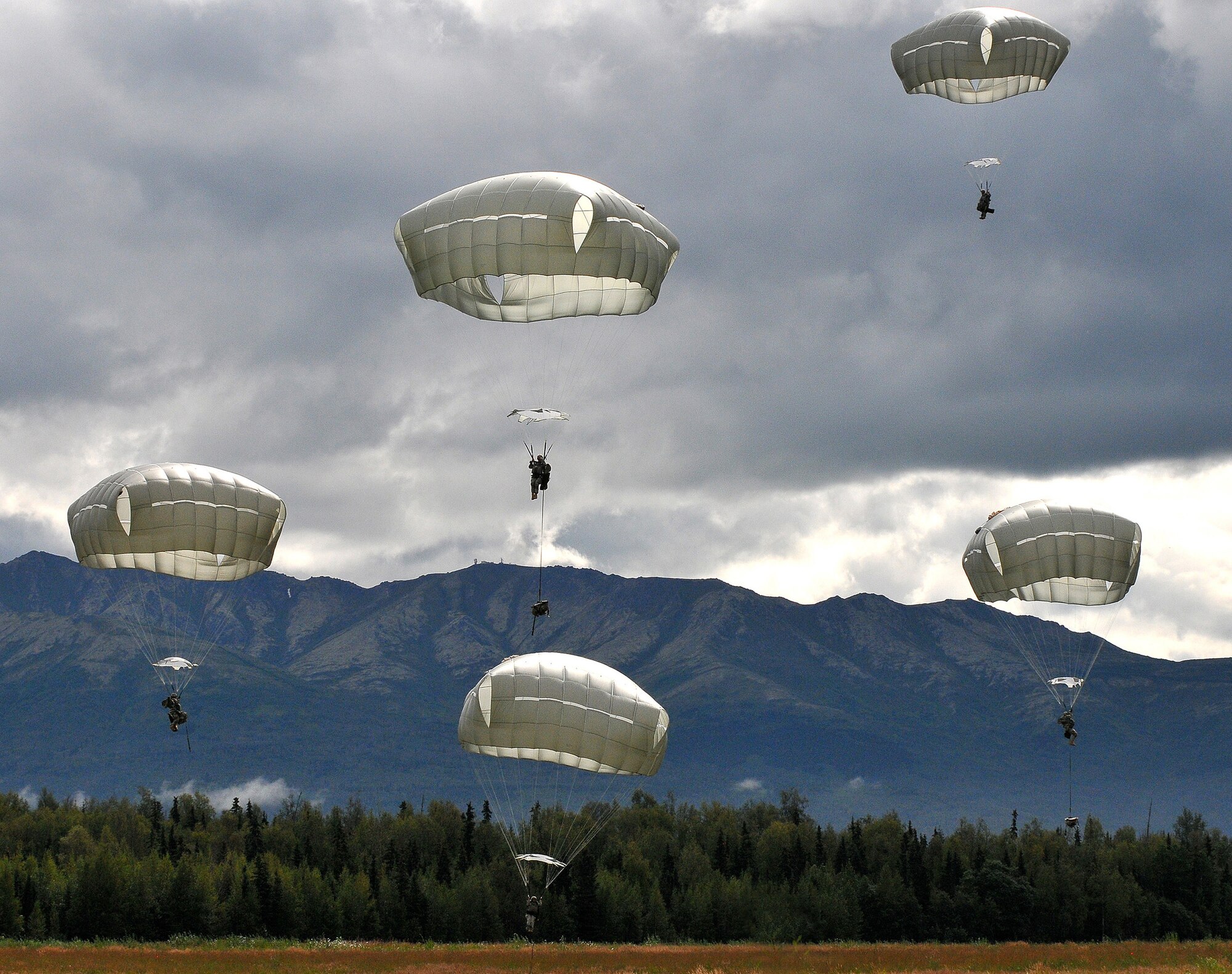 WRIGHT-PATTERSON AIR FORCE BASE, Ohio – Tech. Sgt. Frank Oliver, 445th Airlift Wing Public Affairs photographer, won in four categories of the 2014 Air Force Reserve Command Media Contest. He took first place for this photograph featured in the Picture Story category of airborne soldiers assigned to the 25th Infantry Division stationed, Joint Base Elmendorf-Richardson, Alaska performing a night jump from a C-17 Globemaster III. (U.S. Air Force photo/Tech. Sgt. Frank Oliver)