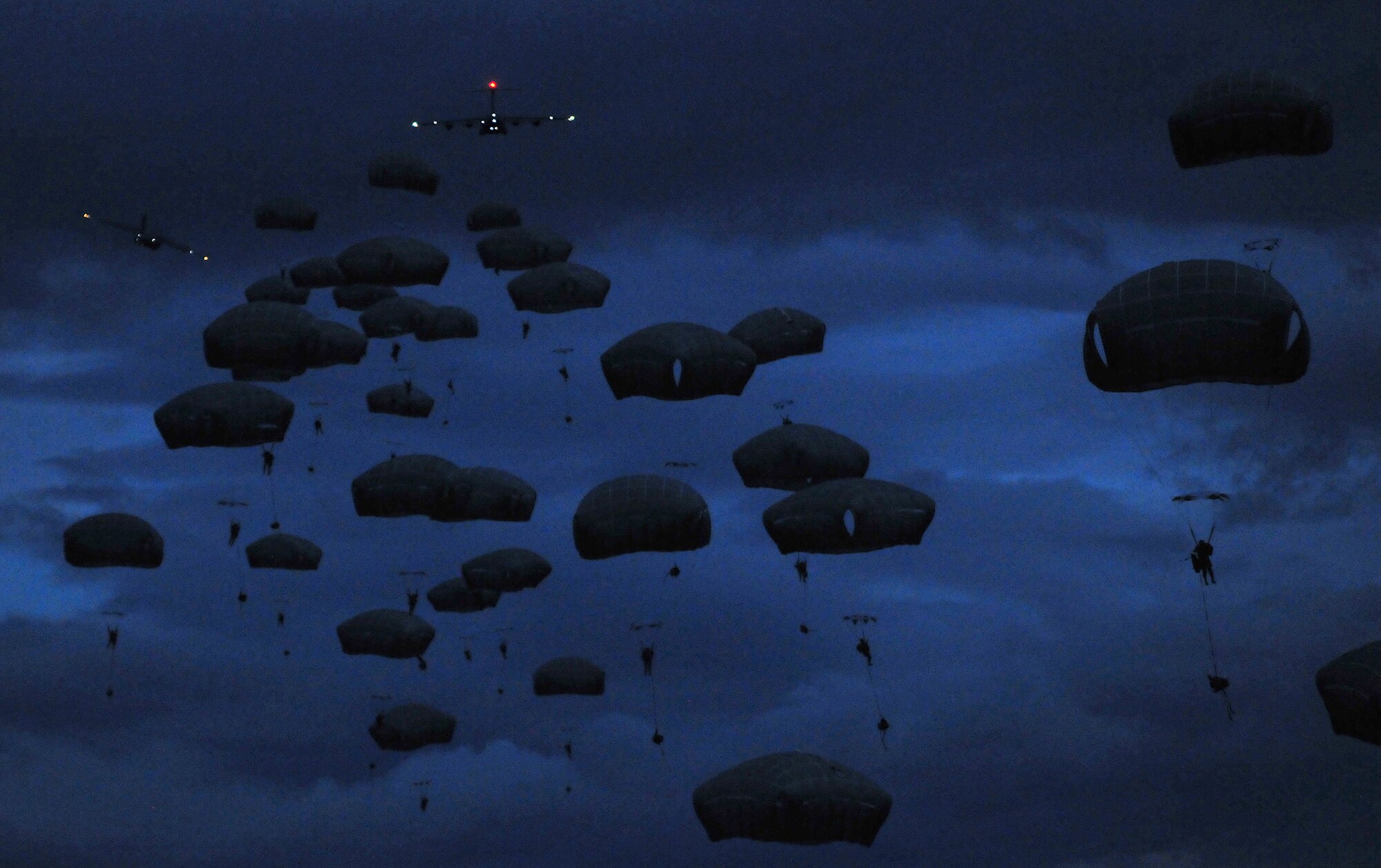 WRIGHT-PATTERSON AIR FORCE BASE, Ohio – Tech. Sgt. Frank Oliver, 445th Airlift Wing Public Affairs photographer, won in four categories of the 2014 Air Force Reserve Command Media Contest. He took first place for this photograph in the Pictorial Photograph category featuring airborne soldiers assigned to the 25th Infantry Division, Joint Base Elmendorf-Richardson, Alaska, performing a night jump from a C-17 Globemaster III. (U.S. Air Force photo/Tech. Sgt. Frank Oliver)
