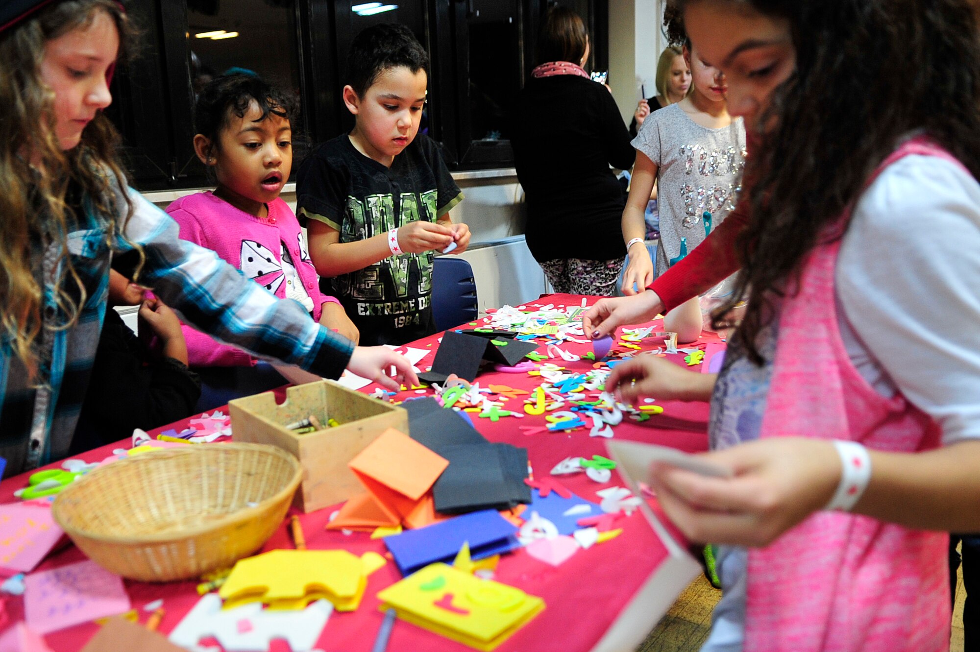 Children make arts and crafts during the the “Frozen” family event, Jan. 26, 2015 at the Ramstein Community Center on Ramstein Air Base, Germany. Children and their families had the opportunity to meet one of the movie’s characters, Olaf, as well as make arts and crafts, play in a bouncy house and take home balloon animals. (U.S. Air Force photo/Airman 1st Class Larissa Greatwood)