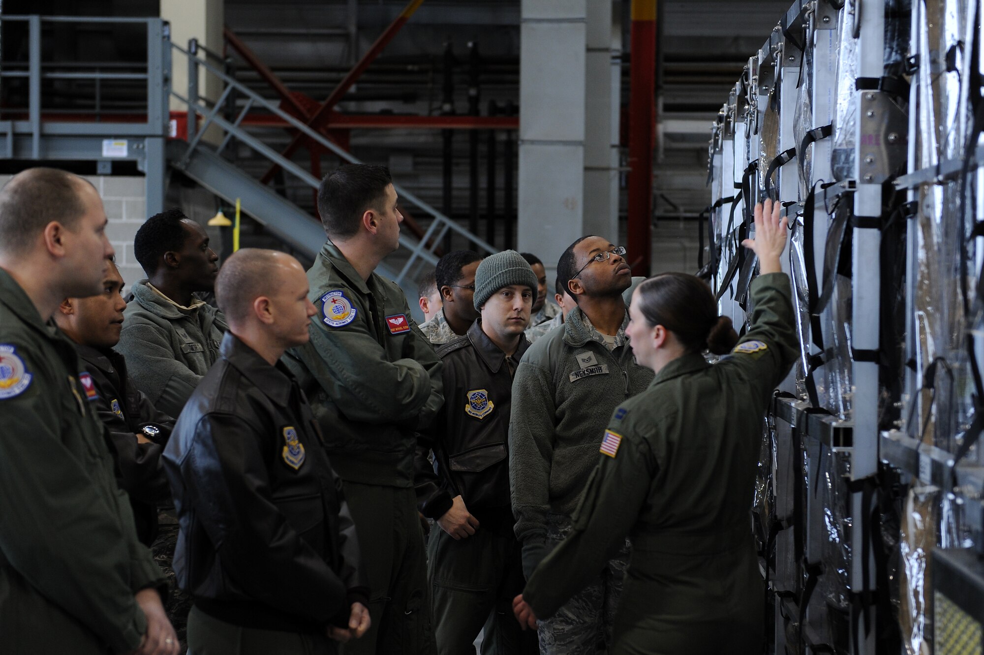 Capt. Michelle Pierson, Air Mobility Command flight nurse evaluator, instructs members of the 375th and 932nd Aeromedical Evacuation Squadrons on the Transport Isolation System at Scott Air Force Base, Illinois, Jan. 26, 2015. Pierson was one of many Team Scott members who has been and continues to advise Production Products Inc., the company who built the TIS, and one of the members responsible for writing all the new regulations and guidance for AMC. (U.S. Air Force photo/Staff Sgt. Jonathan Fowler)