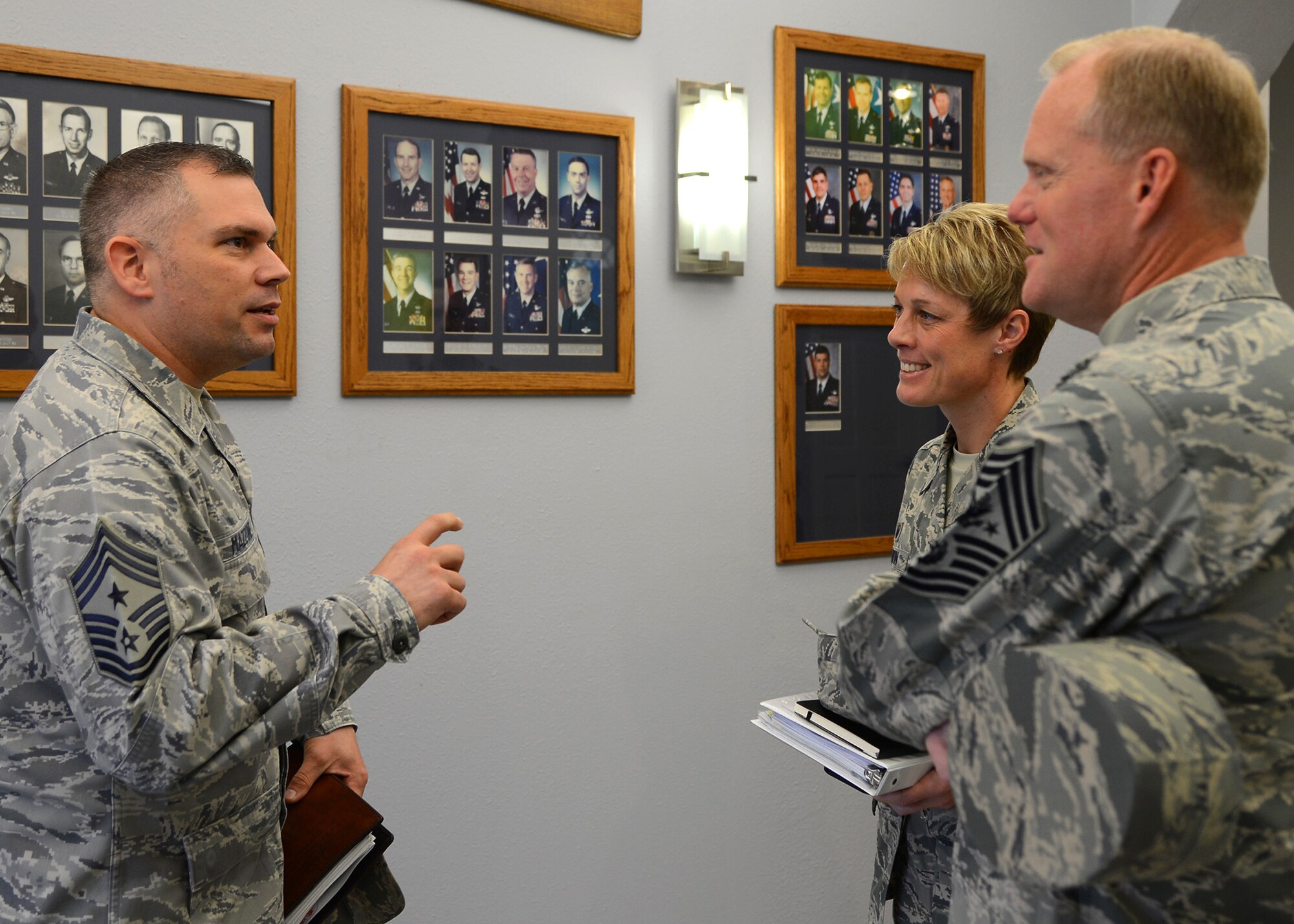 Chief Master Sgt. Thomas Mazzone, 2nd Bomb Wing command chief, speaks with Col. Kristin Goodwin, center, 2nd BW commander, and Chief Master Sgt. of the Air Force James Cody about the history of the commanding officers of the Mighty Deuce on Barksdale Air Force Base, La., Jan. 22, 2015. Cody received a mission brief from Airmen about the history and legacy of the base. (U.S. Air Force photo/Senior Airman Joseph A. Pagán Jr.)