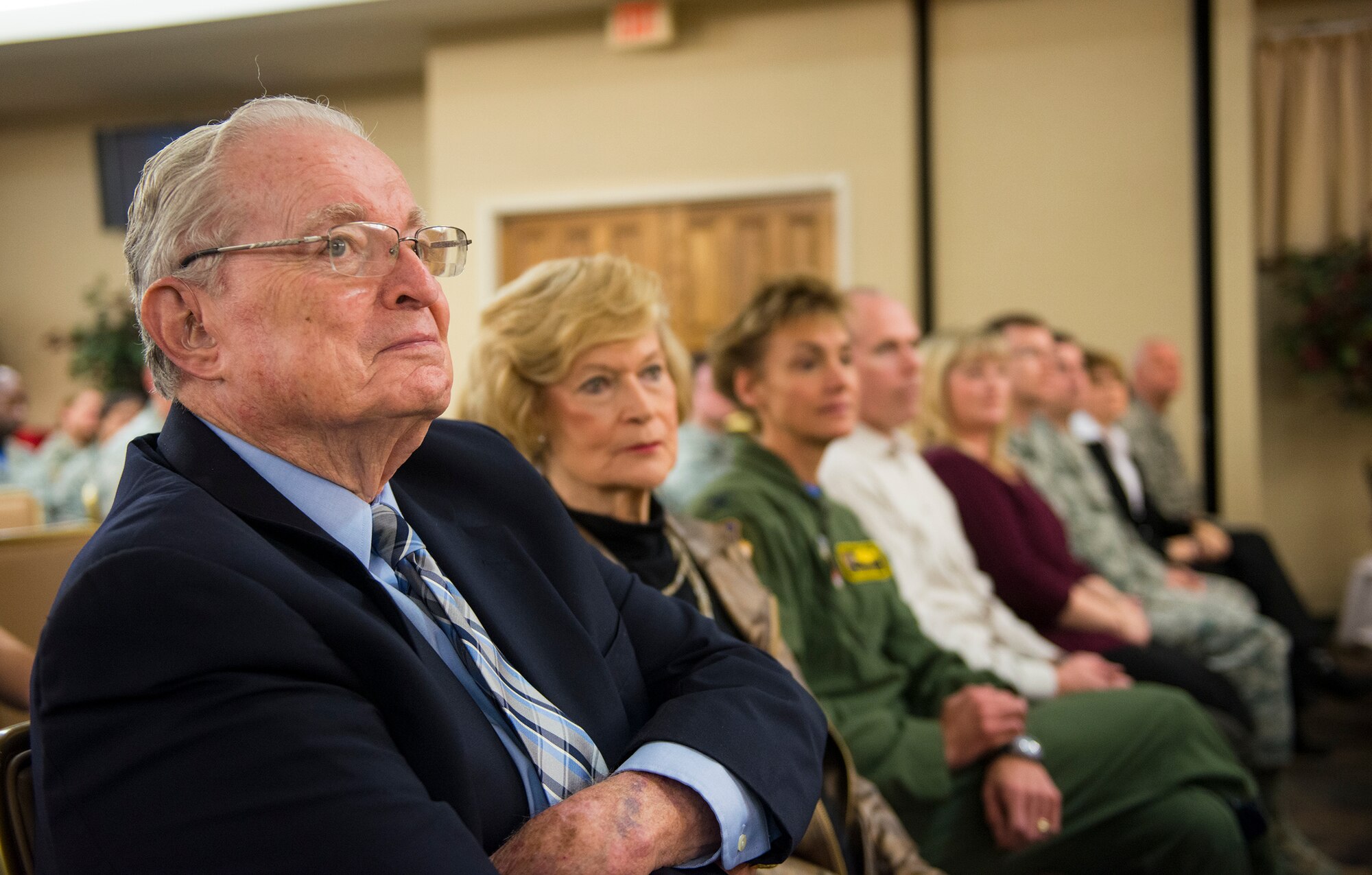 Moody Air Force Base supporters Parker Greene and Dr. Lucy Greene take heed to a speech during the Honorary Commander assumption of command ceremony Jan. 23, 2015, at Moody Air Force Base, Ga. U.S Air Force Col. Chad Franks, 23d Wing commander, welcomed the 17 incoming honorary commanders and stated he looks forward to working with them in the future. (U.S. Air Force photo by Airman 1st Class Ceaira Tinsley/Released)
