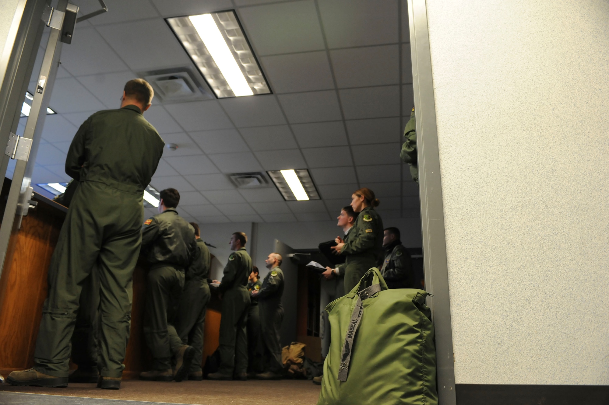 B-52H Stratofortress crewmembers attend a preflight briefing on Minot Air Force Base, N.D., Jan. 22, 2015. Preflight briefings are held to discuss weather conditions, outline the mission and ensure every crewmember is informed of all possible scenarios they might encounter while in the air. (U.S. Air Force photo/Senior Airman Stephanie Morris)