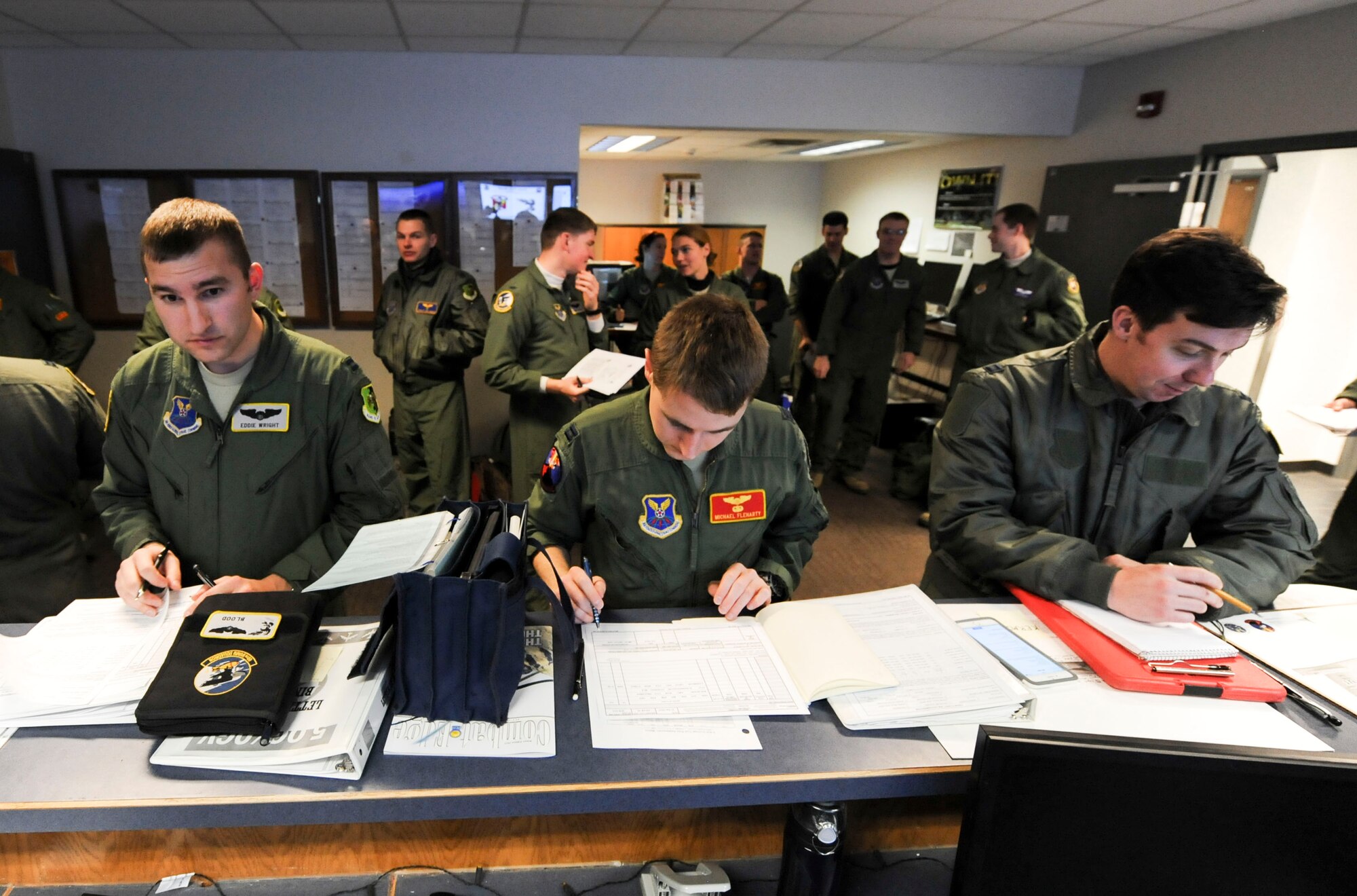 B-52H Stratofortress crewmembers attend a preflight briefing on Minot Air Force Base, N.D., Jan. 22, 2015. Preflight briefings are held to discuss weather conditions, outline the mission and ensure every crewmember is informed of all possible scenarios they might encounter while in the air. (U.S. Air Force photo/Senior Airman Stephanie Morris)