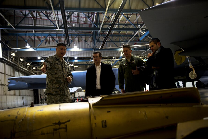 Tech. Sgt. Philip Plinski, 5th Maintenance Group load standardization crew team chief, gives a tour of Dock 7 to distinguished visitors on Minot Air Force Base, N.D., Jan. 22, 2015. Visitors also toured various units across the base and a missile alert facility. (U.S. Air Force photo/Senior Airman Brittany Y. Bateman)
