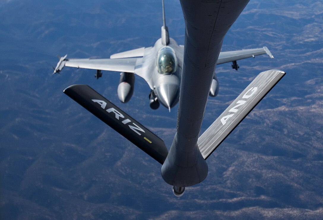 An F-16 Fighting Falcon from the 162nd Wing in Tucson approaches the boom of a KC-135 Stratotanker from the 161st Air Refueling in Phoenix during a refueling exercise Feb. 22 over southern Arizona. Arizona National Guard aircraft and aircrews will support the North American Aerospace Defense Command mission of securing the airspace over Super Bowl XLIX. (U.S. Army National Guard photo by Staff Sgt. Brian A. Barbour)