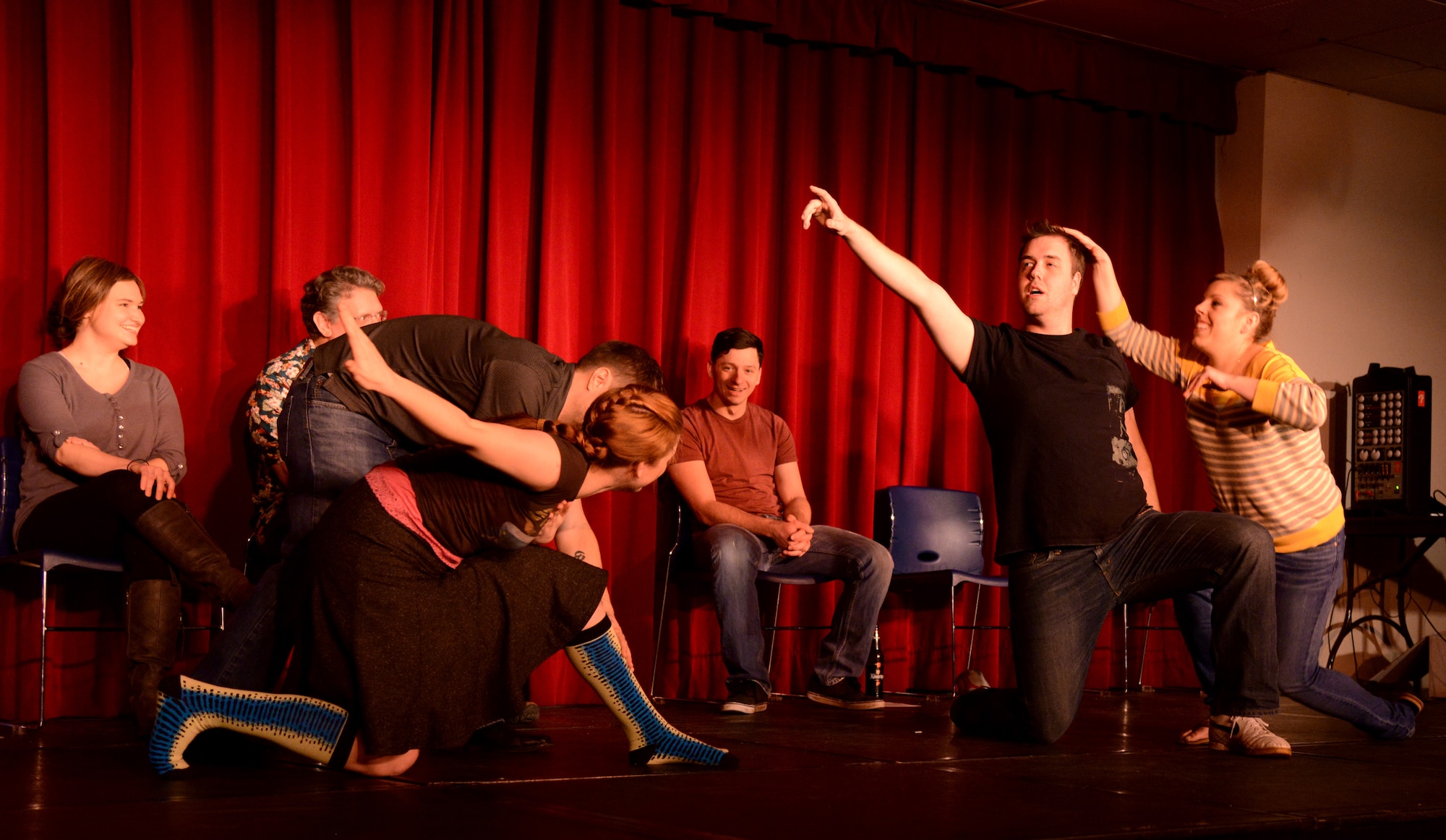 Members of the audience move Strike Force Comedy cast during an improv game of “New Year Nuttiness” at Ramstein Air Base, Germany, Jan. 24, 2015. New Year Nuttiness was modeled after a popular improv comedy TV show but made variations to some of the games typically played on the show. (U.S. Air Force photo/Senior Airman Timothy Moore)