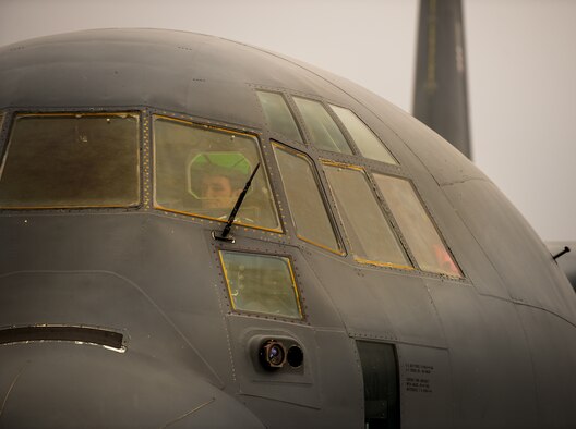 Capt. Kenneth Jubb, 37th Airlift Squadron pilot, performs pre-flight checks in a C-130J Super Hercules for a training mission at Ramstein Air Base, Germany, Jan. 22, 2015. Since he was a child, Jubb has chased a dream to one day fly, and now as a pilot he relives his childhood fantasy every time he takes to the air. (U.S. Air Force photo/Senior Airman Jonathan Stefanko)