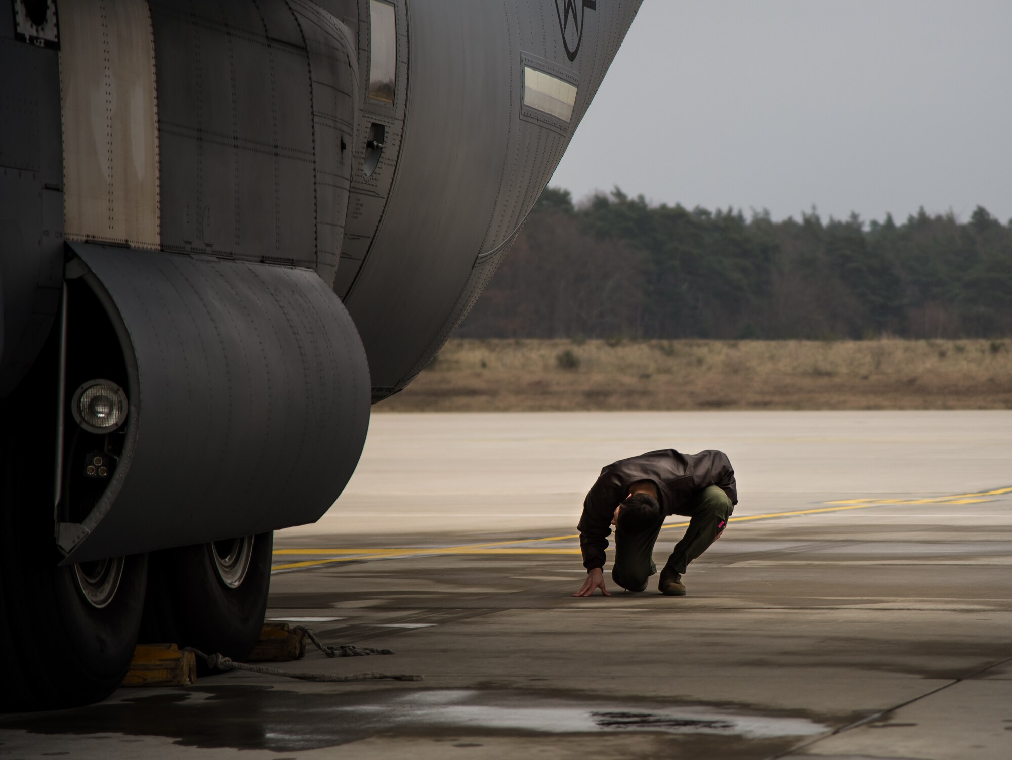 Capt. Kenneth Jubb, 37th Airlift Squadron pilot, performs pre-flight checks of a C-130J Super Hercules Jan. 22, 2015, at Ramstein Air Base, Germany. The aircraft is capable of taking off and landing on rough dirt strips and is the prime transport for air dropping troops, and equipment into hostile areas. (U.S. Air Force photo/Senior Airman Jonathan Stefanko)