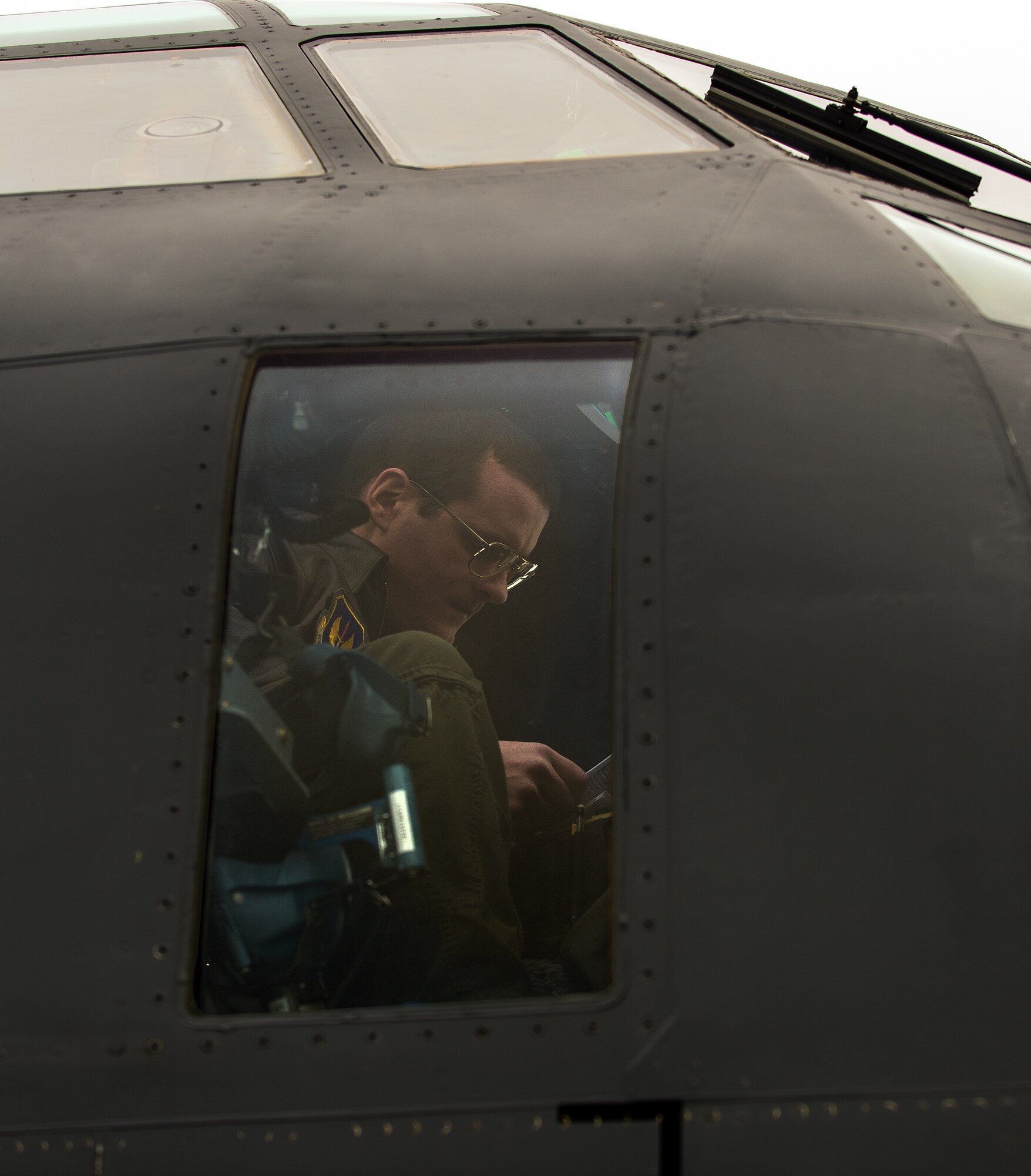 First Lt. Robert Stephenson, 37th Airlift Squadron co-pilot, prepares for a training mission in a C-130J Super Hercules Jan. 22, 2015, at Ramstein Air Base, Germany. Using its loading ramp and door, the C-130 can accommodate a wide variety of oversized cargo, including everything from utility helicopters and six-wheeled armored vehicles to standard palletized cargo and military personnel. (U.S. Air Force photo/Senior Airman Jonathan Stefanko)