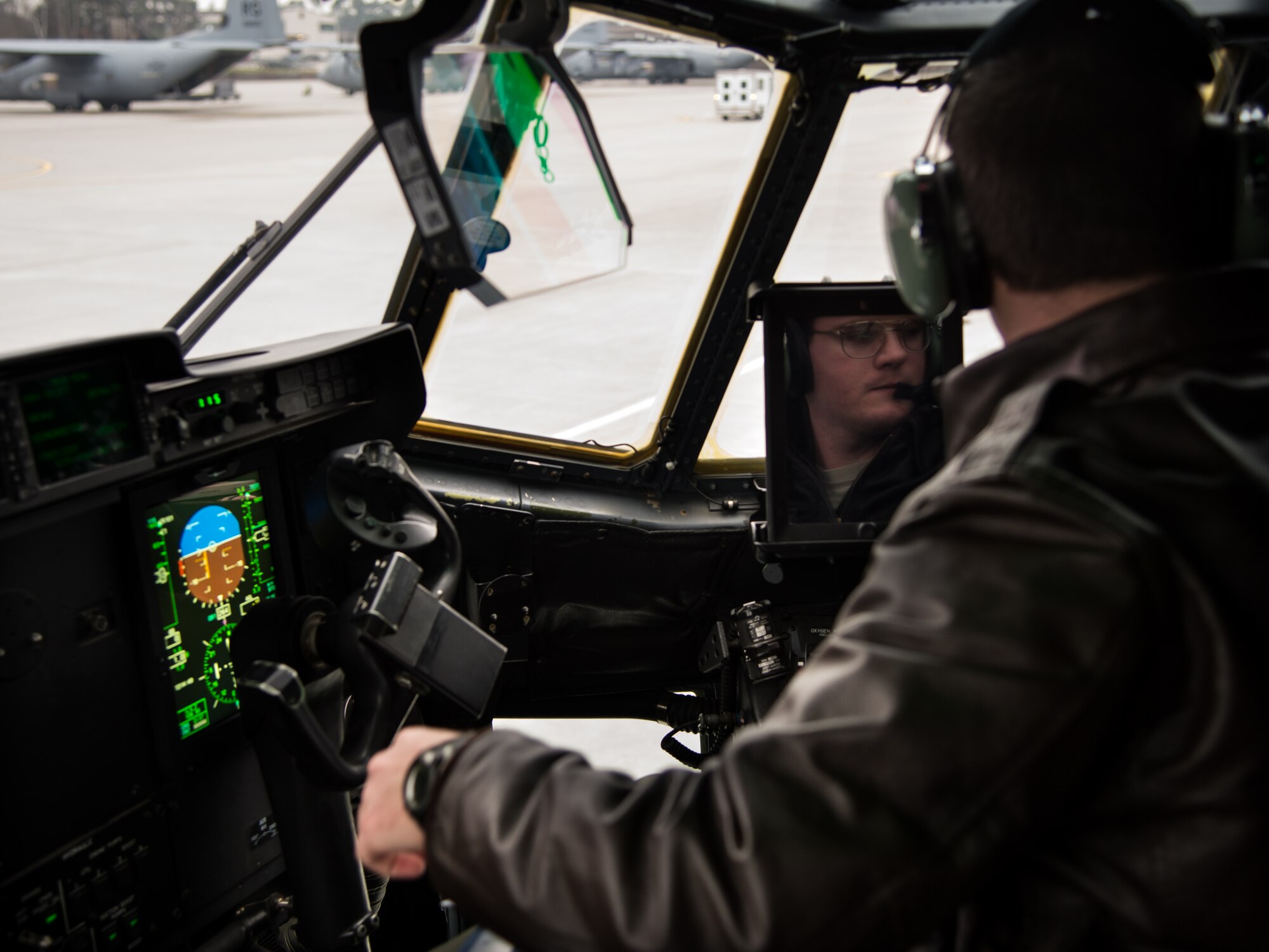 First Lt. Robert Stephenson, 37th Airlift Squadron co-pilot, prepares for a training mission in a C-130J Super Hercules Jan. 22, 2015, at Ramstein Air Base, Germany. Using its loading ramp and door, the C-130 can accommodate a wide variety of oversized cargo, including everything from utility helicopters and six-wheeled armored vehicles to standard palletized cargo and military personnel. (U.S. Air Force photo/Senior Airman Jonathan Stefanko)