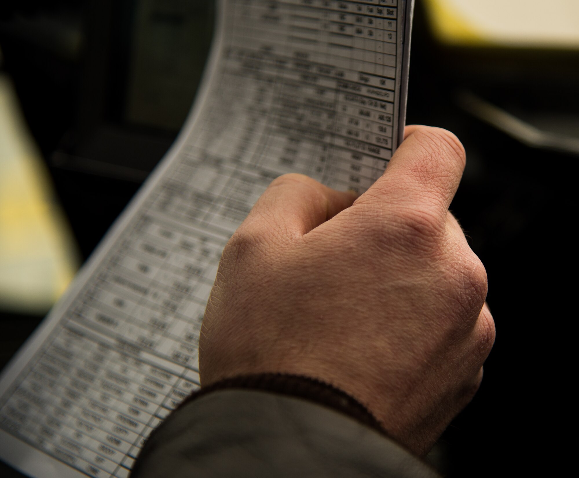 First Lt. Robert Stephenson, 37th Airlift Squadron co-pilot, reads flight plans before a training mission Jan. 22, 2015, at Ramstein Air Base, Germany. During the mission, Stephenson and the pilot flew 7,000 feet for approximately three hours to maintain proficiency. (U.S. Air Force photo/Senior Airman Jonathan Stefanko)