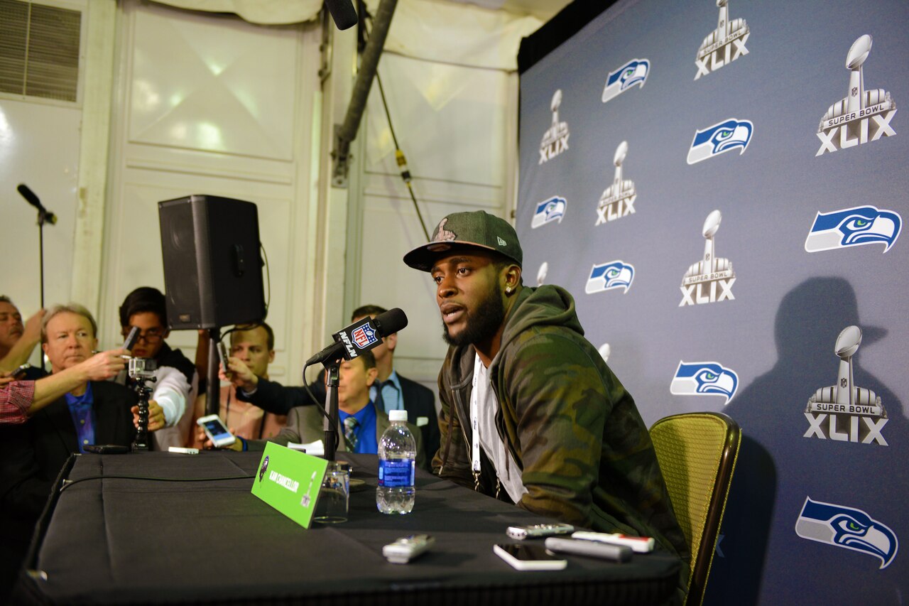 Kam Chancellor, a defensive back for the National Football League’s defending champion Seattle Seahawks, talks to members of the media during Super Bowl Week in Glendale, Ariz., Jan. 26, 2015. Chancellor gave a shoutout to U.S. troops serving abroad who will be watching the NFL’s championship game. DoD photo by Army Sgt. 1st Class Tyrone C. Marshall Jr.