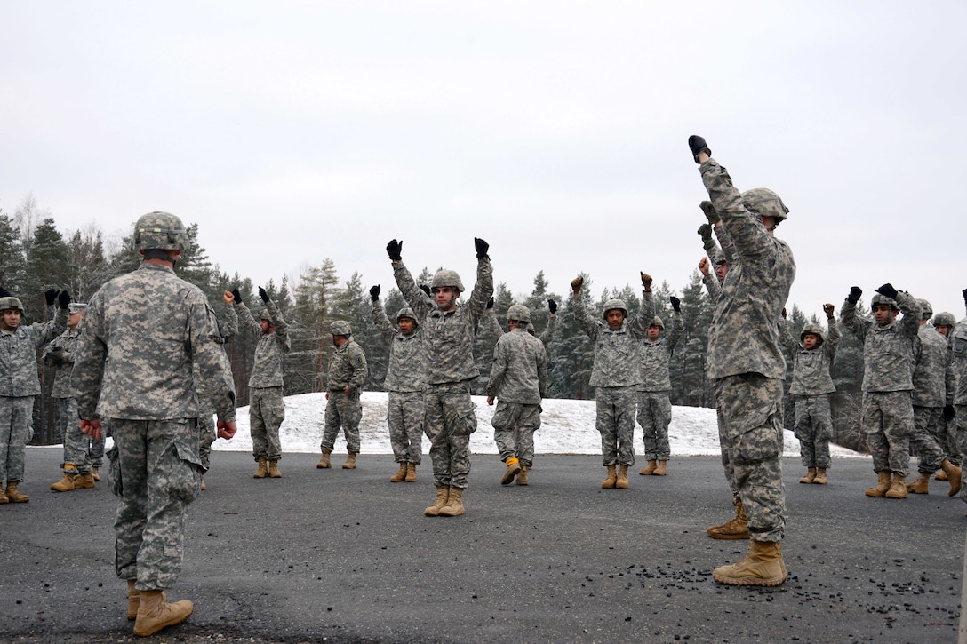 U.S. soldiers rehearse parachute landing falls at the 7th Army Joint Multinational Training Command's Grafenwoehr Training Area, Germany, Jan. 21, 2015. The soldiers are paratroopers assigned to the 1st Squadron, 91st Cavalry Regiment, 173rd Airborne Brigade.
