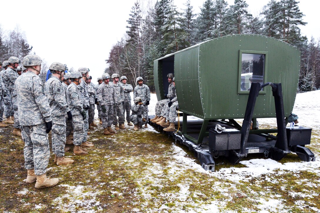 Download U.S. soldiers sitting in a UH-60 Black Hawk helicopter mock-up conduct pre-jump training at the ...