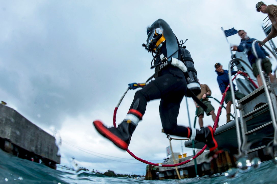 Navy Petty Officer 2nd Class David Madmon conducts a surface supplied dive using the Kirby Morgan 37 dive helmet during diver training aboard the USAV Matamoros on Naval Air Station Key West, Fla. Jan. 16, 2015. Madmon is a builder assigned to the Underwater Construction Team Two.