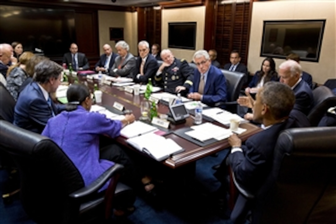 President Barack Obama and Vice President Joe Biden meet with members of the National Security Council, including Defense Secretary Chuck Hagel, center right, and Army Gen. Martin E. Dempsey, chairman of the Joint Chiefs of Staff, in the Situation Room of the White House, Sept. 10, 2014. 