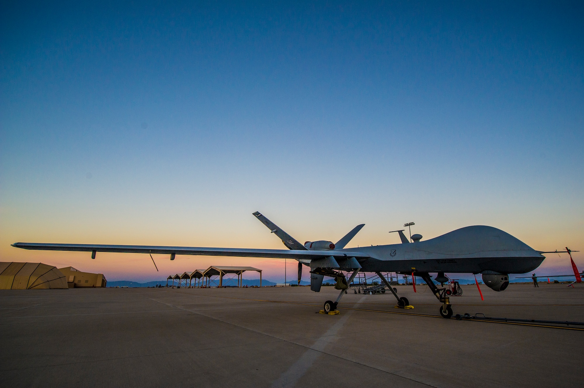 An MQ-9 Reaper sits on the flight line of Holloman Air Force Base, N.M., Jan. 27. The MQ-9 is involved in remote split-operations which allows Airmen at Ellsworth Air Force Base, S.D.,to fly and train on aircraft shared with Holloman AFB. (U.S. Air Force photo by Airman 1st Class Aaron Montoya/released) 