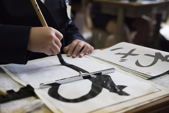 Students at Nishiki Seiryu Elementary School practice Japanese calligraphy Jan. 23, 2015. Teaching to write Japanese calligraphy is similar to learning to write cursive in the U.S.