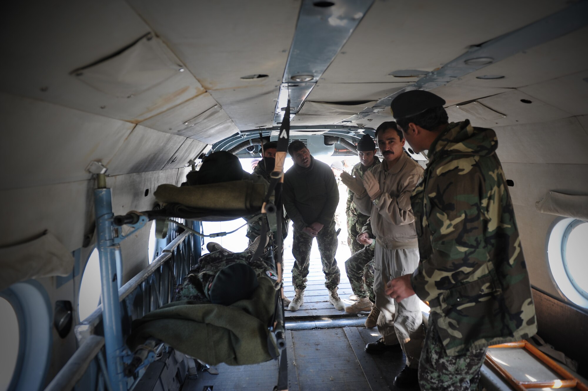 Sgt. Maj. Ghulam Sakhi Haidari, a senior Afghan Air Force flight medic, explains Mi-17 Hip patient loading procedures to Afghan National Army soldiers during a training event in Herat, Afghanistan, Jan. 26, 2015. Haidari was one of two flight medics who traveled from the Kabul Air Wing to Herat to teach 19 students the fundamentals of casualty evacuation. (U.S. Air Force photo/Capt. Jeff M. Nagan)