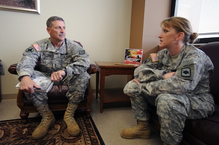 Army Maj. Gen. William Wofford, the adjutant general of the Arkansas National Guard, and Army Capt. Tanya Phillips, the state's suicide prevention program manager, discuss a Soldier's case before visiting with him at the Central Arkansas Veterans Heathcare System's Eugene J. Towbin Healthcare Center on April 17, 2010. "It takes the strength and courage of a warrior to ask for help," Wofford said. The Arkansas National Guard has aggressively pursued innovative ways to help troubled Citizen-Soldiers and -Airmen since leaders first noticed increased warning signs about two years ago.