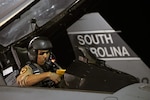 Capt. Ryan "Bago" Madrid, an F-16 Fighting Falcon pilot assigned to the 157th Fighter Squadron of the South Carolina Air National Guard prepares to launch from McEntire Joint National Guard Base enroute to an Air Expeditionary Force deployment to Southwest Asia, May 14, 2010.