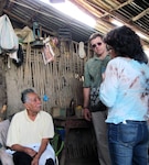 Air Force Lt. Col. (Dr.) Steve Nathanson (center) listens as his translator asks a question of an elderly resident of a rural village near Batan Grande in the Lambayeque District of Peru.