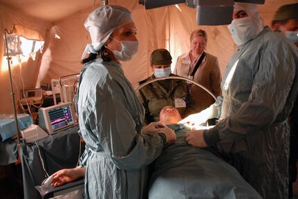 Wyoming state Rep. Lori Millin, back center, watches Tunisian medical technicians demonstrate capabilities during the MEDLITE-10 exercise in Tunisia. Service members from several states visited the north African country while participating in the MEDLITE-10 exercise at Kharrouba Air Base, Bizerte, Tunisia.